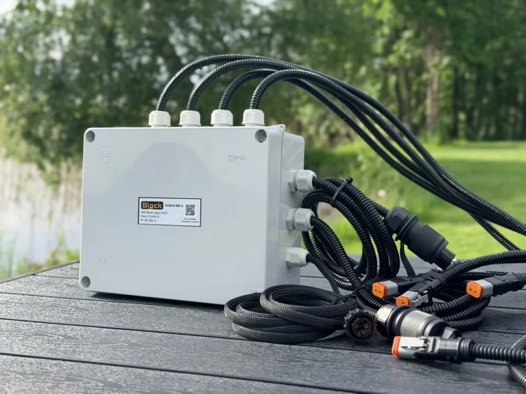 An 8-channel custom build: a grey IP55 enclosure with sleeved leads leaving through cable glands